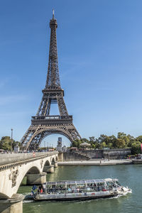  view of the eiffel tower and seine with a boat