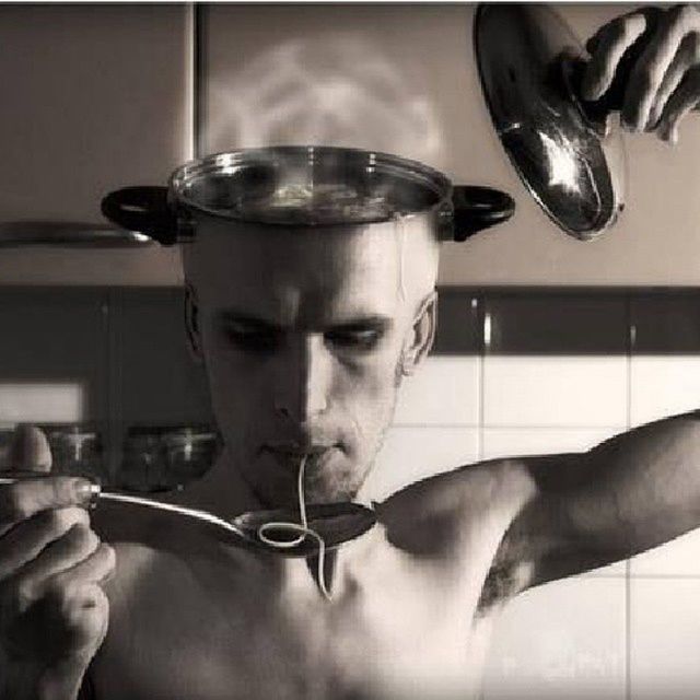 indoors, person, close-up, domestic kitchen, part of, home interior, table, lifestyles, reflection, food and drink, cropped, glass - material, domestic room, men, holding, metal, kitchen utensil