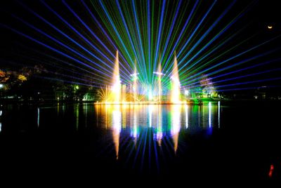 Reflection of illuminated lights on water at night