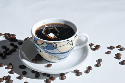 High angle view of coffee cup on table