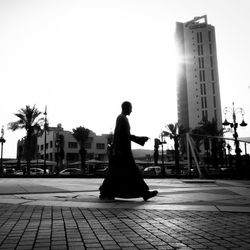 Full length of woman standing in city