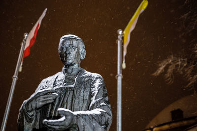 Low angle view of statue against water