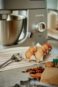 Electric mixer kneads dough in the kitchen