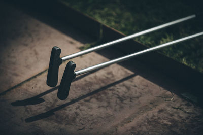 High angle view of black railing on wood