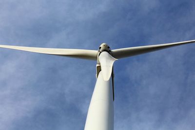 Low angle view of wind turbine against sky