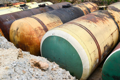 Rusty metal pipe by water