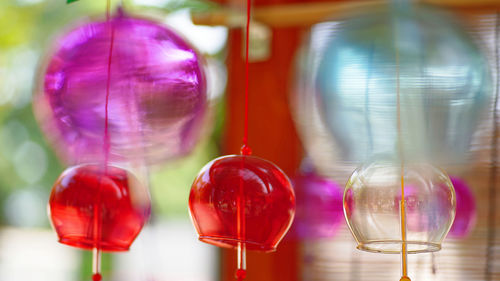 Close-up of multi colored glass hanging