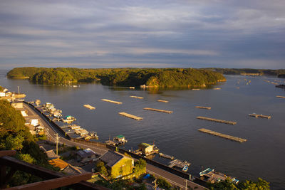 High angle view of harbor by sea against sky