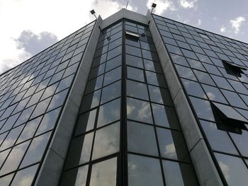 Low angle view of office building against sky