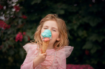 Portrait of girl blowing bubbles