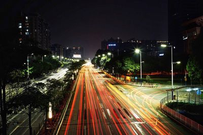 Light trails on urban street at night