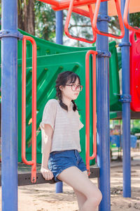 Woman sitting in playground