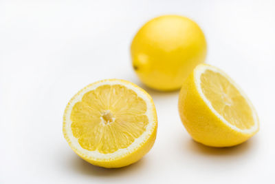 Close-up of oranges against white background