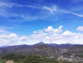 Scenic view of landscape against blue sky