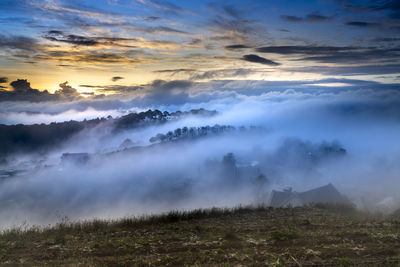 Scenic view of landscape against sky during sunset