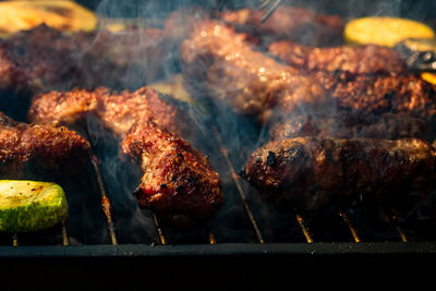 Close-up of meat on barbecue grill