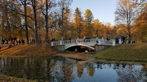 Bridge over canal against sky during autumn