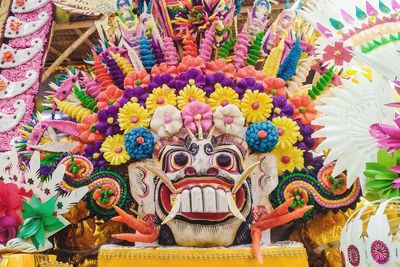 Close-up of buddha statue against wall