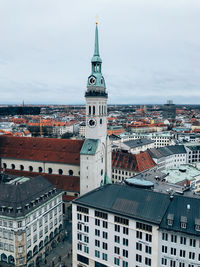 Aerial view of city buildings against sky