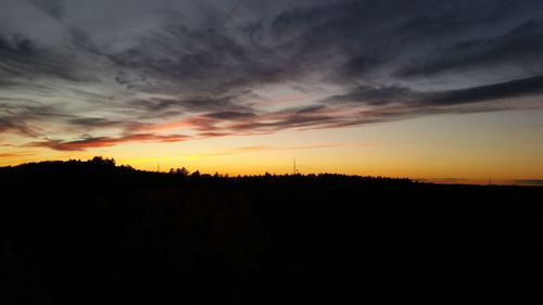 Silhouette of landscape against dramatic sky