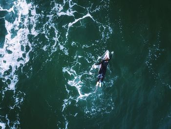 High angle view of man surfing in sea