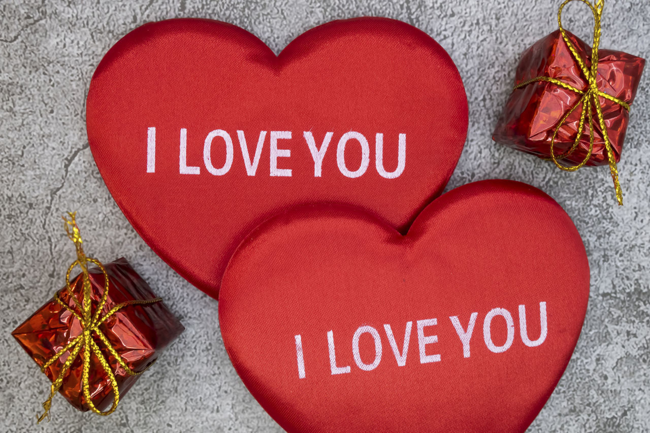 CLOSE-UP OF TEXT ON RED PAPER