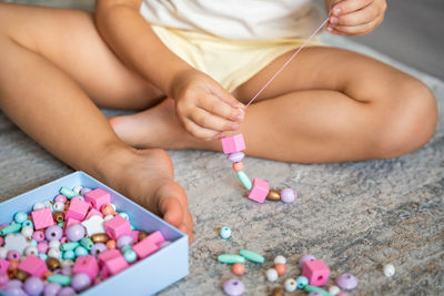 Midsection of woman playing with toy