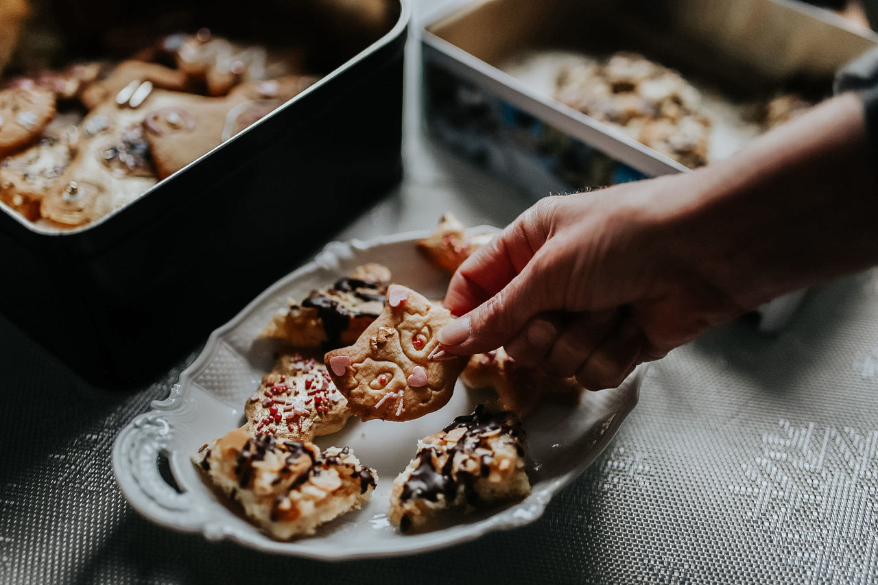 HIGH ANGLE VIEW OF PERSON PREPARING FOOD