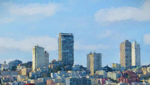 Modern buildings in city against sky