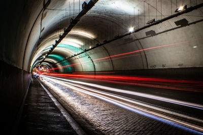 Light trails in illuminated tunnel