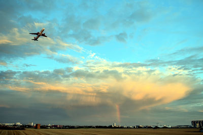 Low angle view of airplane flying in sky