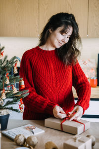 Young woman sitting on table