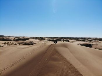 Scenic view of desert against clear sky