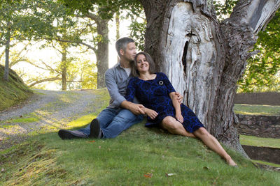 Full length of smiling young couple