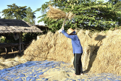 Side view of man walking on field