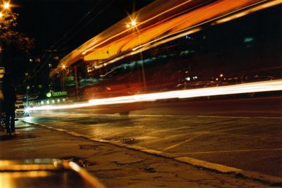 View of illuminated road at night