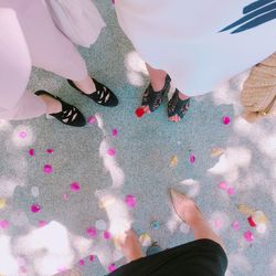 Low section of woman standing on tiled floor