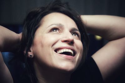 Close-up portrait of a smiling young woman