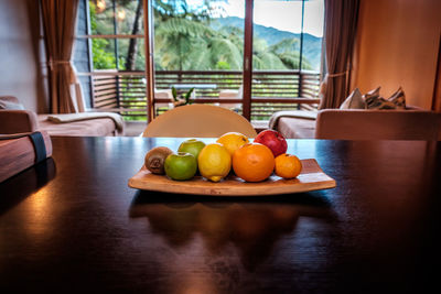 Close-up of fruits on table at home