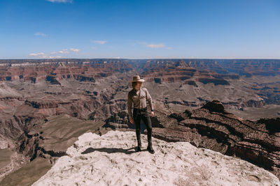 Full length of man standing on rock