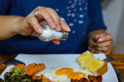 Close-up of women preparing food