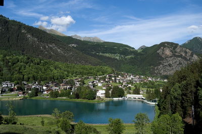 Scenic view of lake and mountains against sky