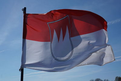 Low angle view of flag against sky