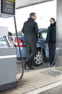 Man standing on a car