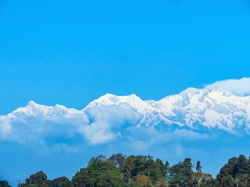 Low angle view of mountains against clear blue sky