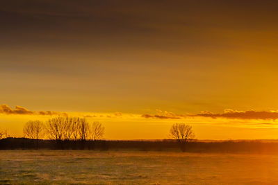 Scenic view of landscape at sunset