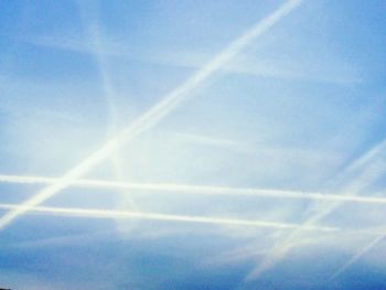 Low angle view of vapor trails in sky