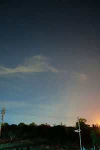 Scenic view of landscape against sky at night