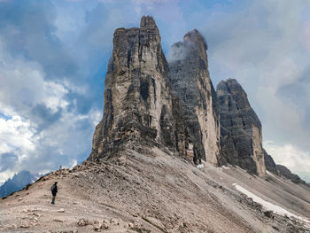 Low angle view of rock formation against sky