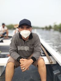 Portrait of young man in boat